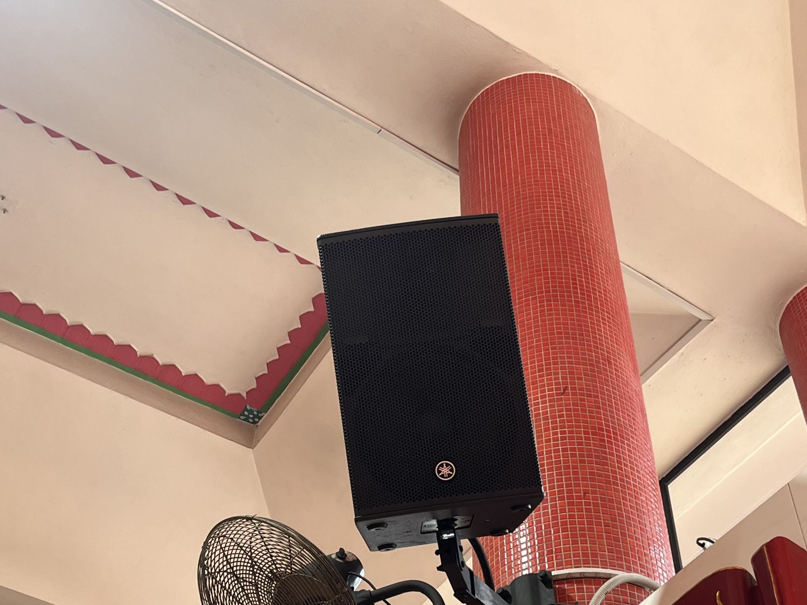 Yamaha CHR12 loudspeaker mounted on a red pillar in the prayer hall at Kuan Im Tng Temple, Joo Chiat, Singapore
